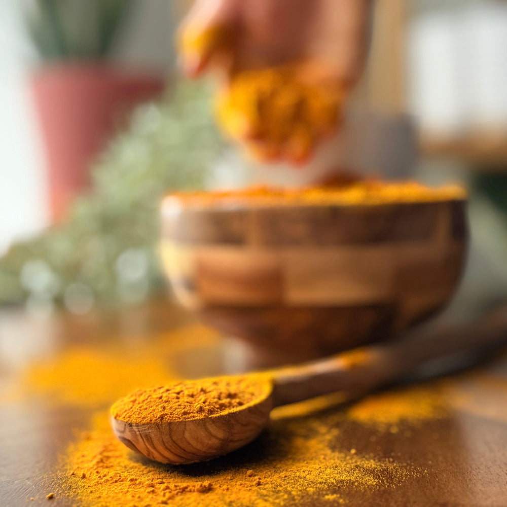 Finely ground, bright yellow organic turmeric powder in eco-friendly packaging from Purely Organic Foods, perfect for seasoning, teas, and spice blends.