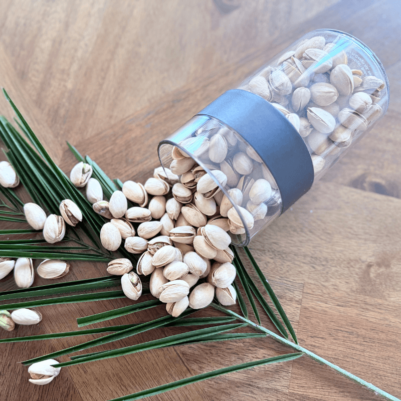 Bowl of organic roasted pistachios with split shells, seasoned with sea salt, perfect as a premium-quality plant-based snack option."

"Certified organic pistachio nuts in naturally split shells, roasted and salted, photographed in eco-friendly packaging for clean-label snacking."