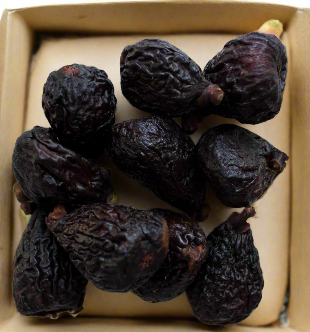 Organic Black Mission figs fresh and ripe, showcasing their deep purple-black skin and sweet, juicy interior, perfect for healthy snacking or cooking