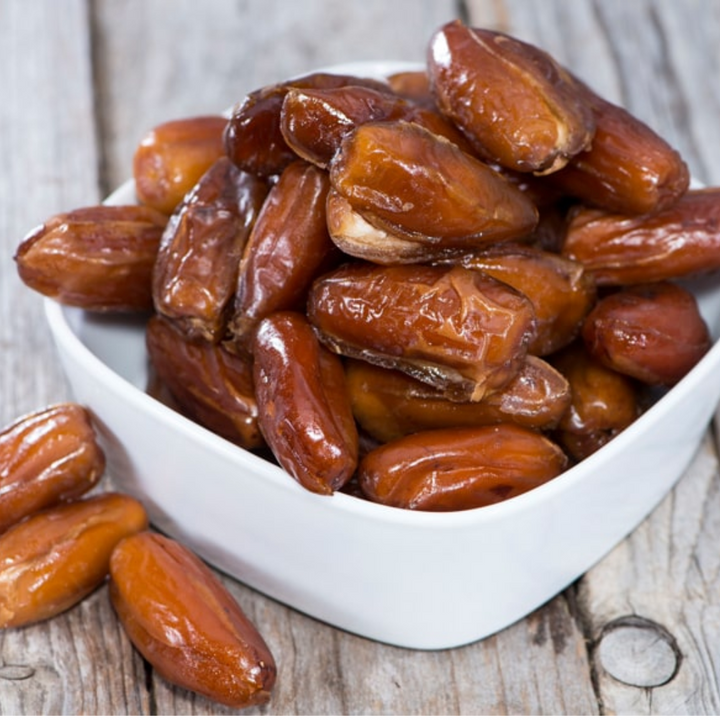 Organic Deglet dates, pitted and naturally sweet, with a soft and chewy texture, perfect for snacking and baking