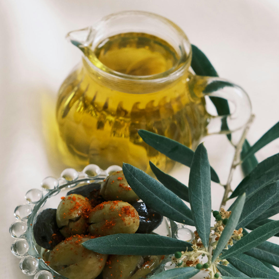 Purely Organic Foods organic extra virgin olive oil in a clear glass bottle, cold-pressed and unrefined, ideal for salad dressings, cooking, and finishing dishes."

"Premium-quality certified organic extra virgin olive oil with a rich golden-green hue, photographed beside fresh olives to emphasize purity and freshness."

"Cold-pressed organic EVOO from Purely Organic Foods, packaged in a dark glass bottle to preserve flavor and nutrients, perfect for everyday culinary use.