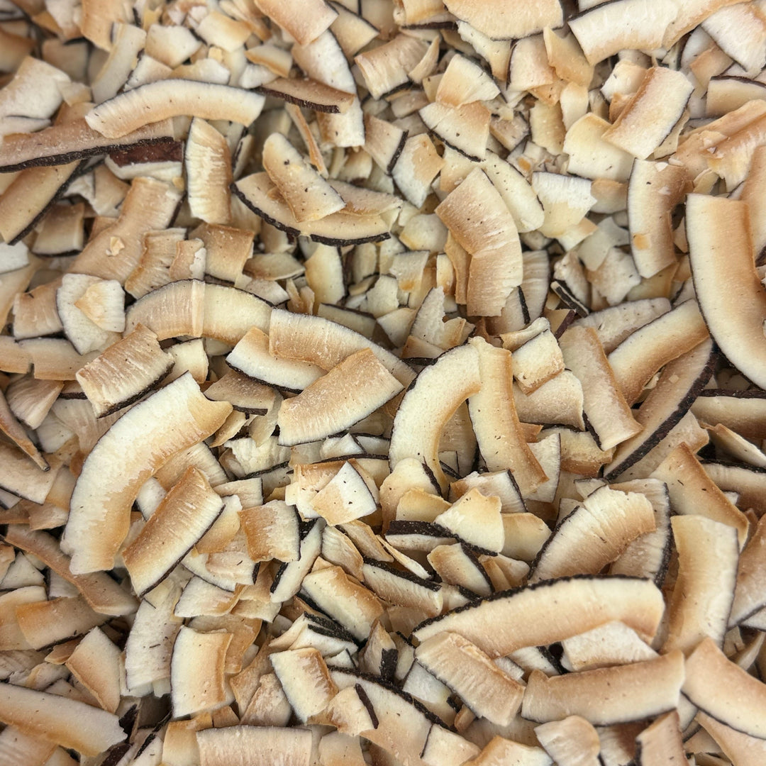 Premium organic toasted coconut slices with a naturally crunchy texture for granola, desserts, and smoothie bowls.