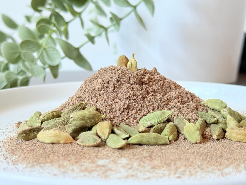 Finely ground organic cardamom seed powder in a bowl from Purely Organic Foods.

Aromatic organic cardamom seed powder by Purely Organic Foods for desserts and teas.