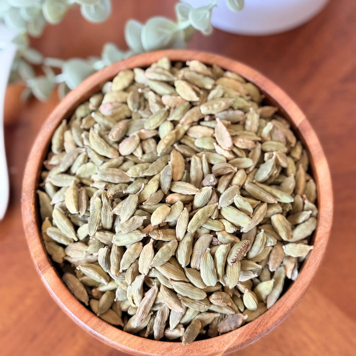 Whole organic cardamom pods with intense natural fragrance, suitable for grinding or infusing in recipes